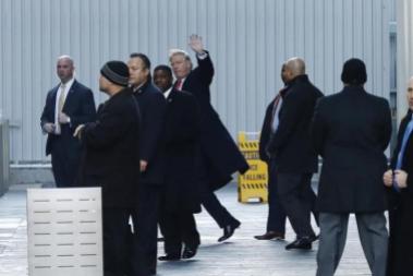 U.S. President-elect Donald Trump (C) exits One World Trade Center following a meeting in Manhattan, New York City, U.S., January 6, 2017. REUTERS/Lucas Jackson
